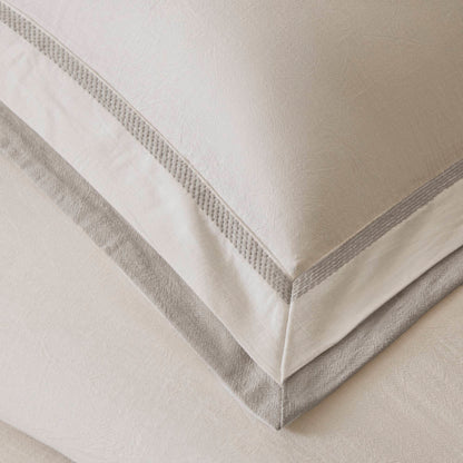 Premium beige bedding with textured fabric, subtle patterns, and elegant trim.